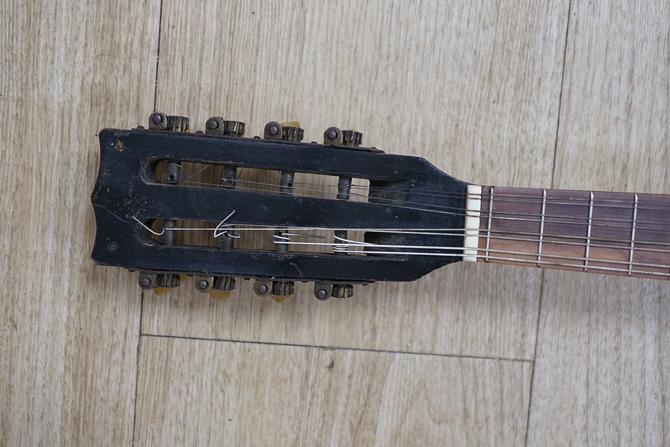 A 1920's Swiss flat backed mandolin, length of body 31cm